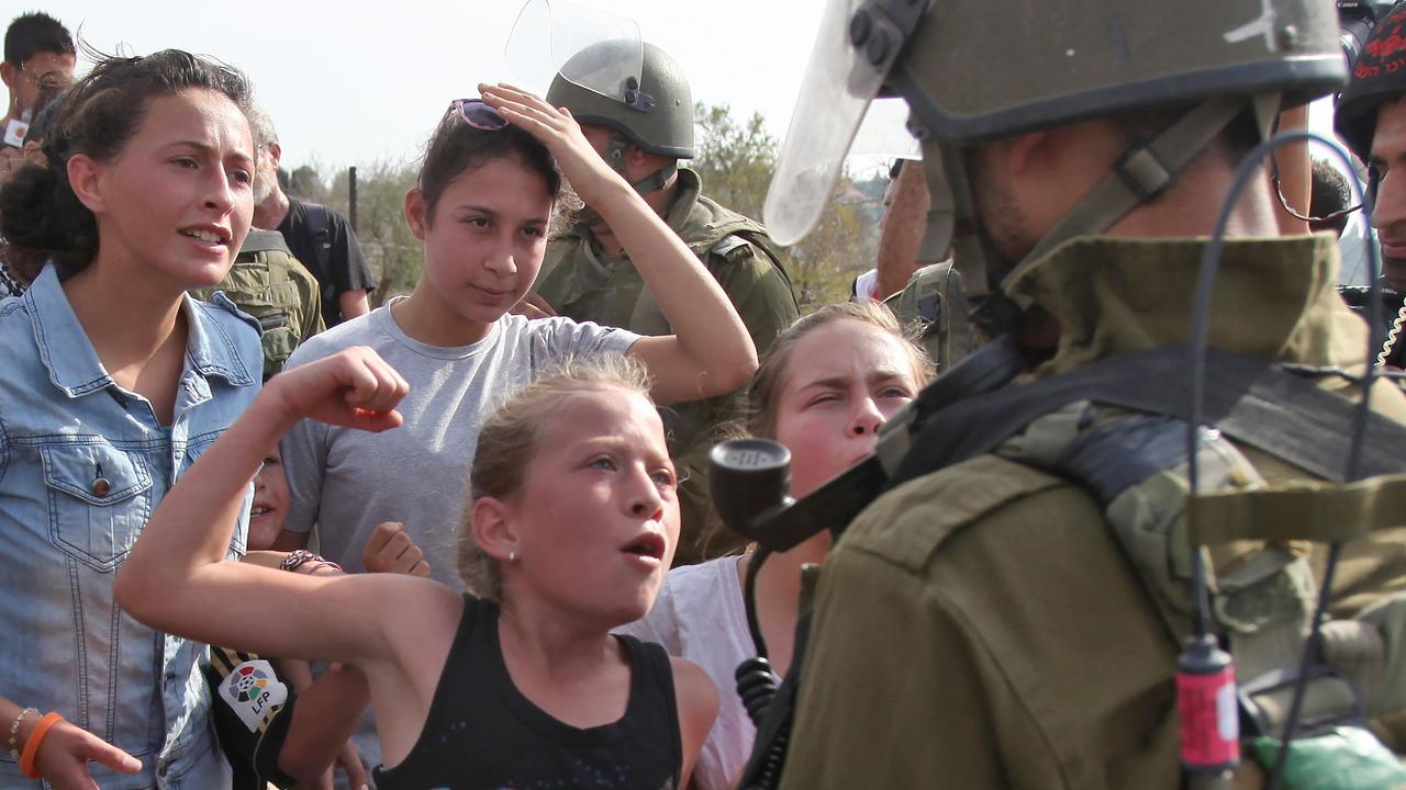 In 2012, Ahed Tamimi was also pictured confronting Israeli soldiers. Picture: AFP