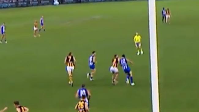 Hawthorn's Tom Mitchell catches North Melbourne's Todd Goldstein high. Picture: Supplied