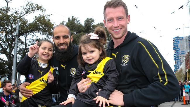 Bachar Houli and his daughters with teammate Dylan Grimes. Picture: Ian Currie