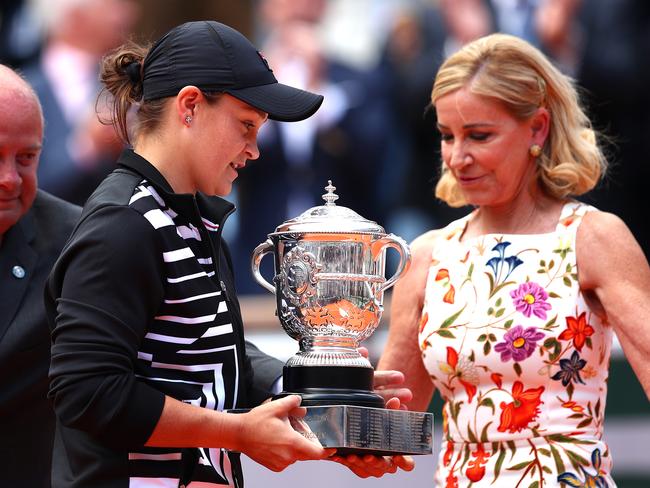 PARIS, FRANCE - JUNE 08: Former American tennis player, Chris Evert hands the winners trophy to Ashleigh Barty of Australia following her ladies singles final against Marketa Vondrousova of The Czech Republic during Day fourteen of the 2019 French Open at Roland Garros on June 08, 2019 in Paris, France. (Photo by Clive Brunskill/Getty Images)