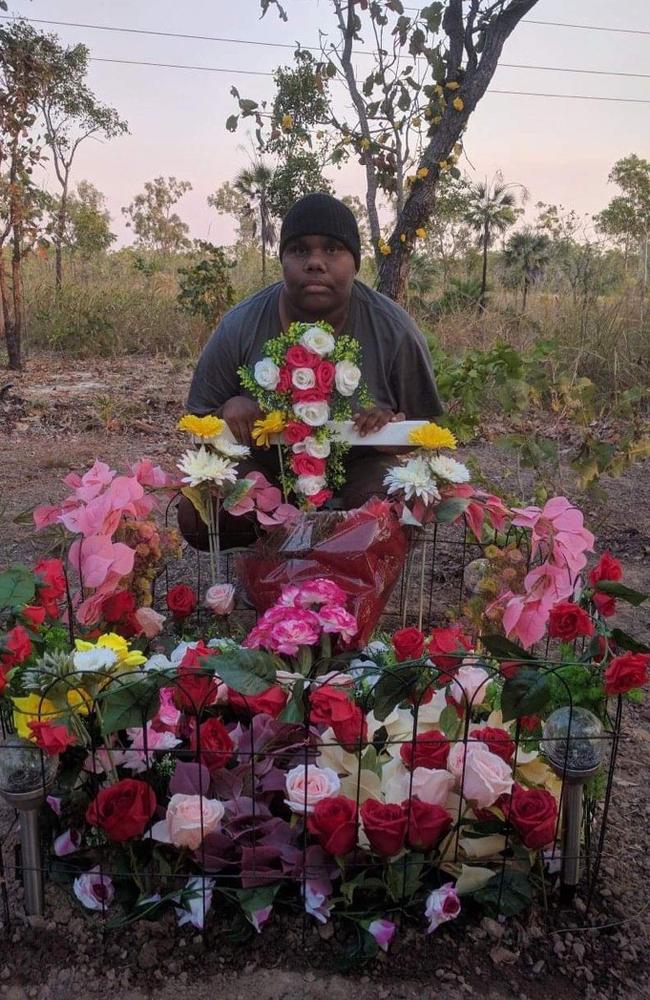 Janita Dixon, the daughter of alleged hit and run victim Kumanjayi Napurrurla Dixon, at her mother's roadside memorial.