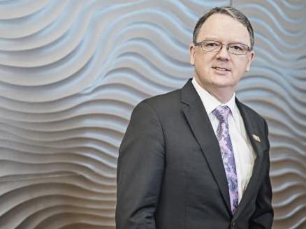 Peter Coleman has taken a $1m pay cut following shareholder pressure.