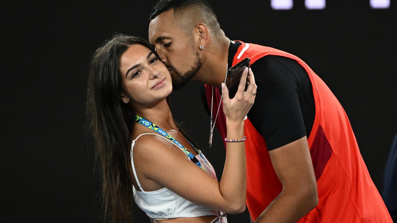 Nick Kyrgios kisses his girlfriend Costeen Hatzi. Photo by Quinn Rooney/Getty Images.