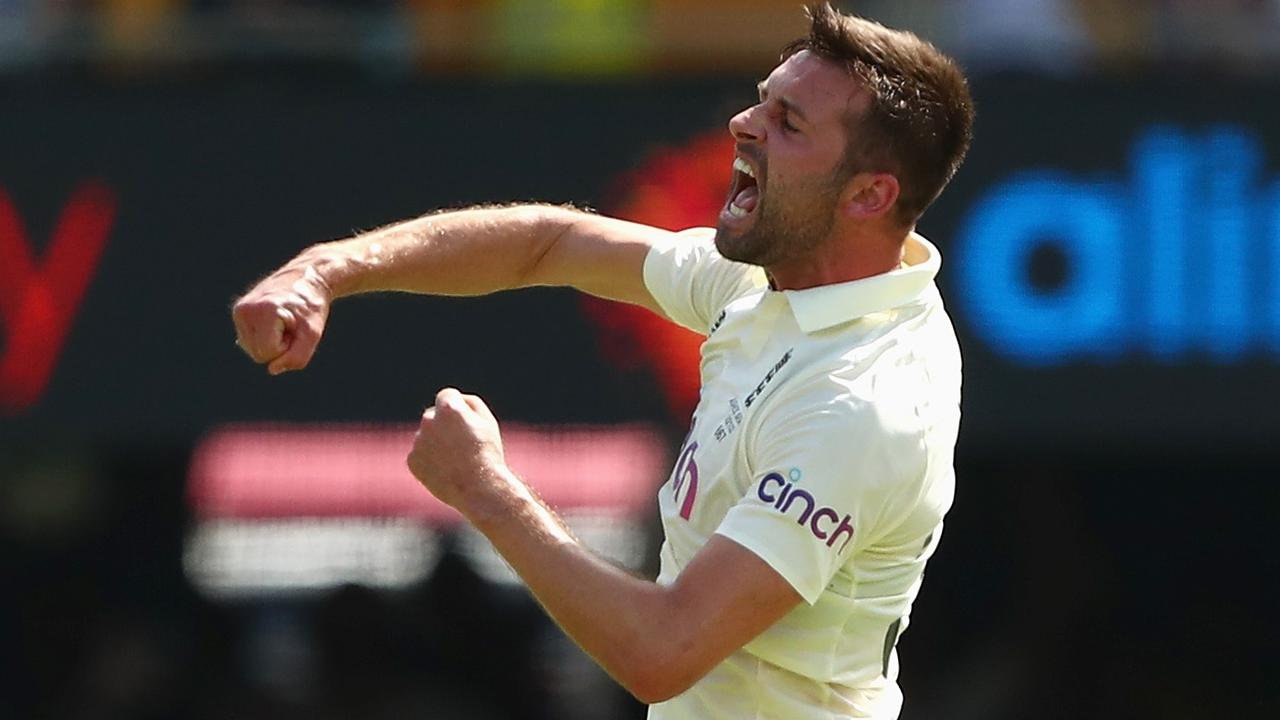 BRISBANE, AUSTRALIA - DECEMBER 09: Mark Wood of England celebrates dismissing Steve Smith of Australia during day two of the First Test Match in the Ashes series between Australia and England at The Gabba on December 09, 2021 in Brisbane, Australia. (Photo by Chris Hyde/Getty Images)