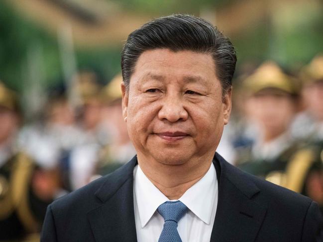 China's President Xi Jinping reviews a military honour guard during a welcome ceremony at the Great Hall of the People in Beijing on December 12, 2018. (Photo by FRED DUFOUR / AFP)