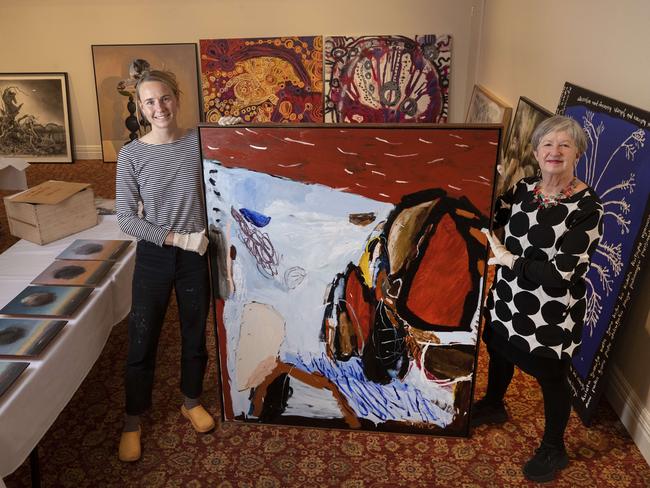 Hadley's Art Prize Packing Room Winner Zoe Grey with her work titled The Shape of Rock with unpacking team member Julie Payne.  Picture: Chris Kidd