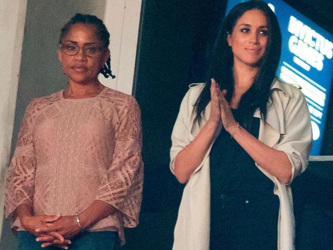 Meghan Markle (C) and her mother Doria Radlan (L) watch the closing ceremonies for the Invictus Games in Toronto, Ontario.  Picture:  AFP