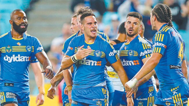 Corey Norman of the Eels celebrates a his try.