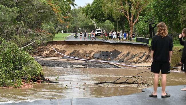 During the latest Barron River flood event Thomatis Creek cut a new path to the sea through a mangroved depression. Flood water was temporarily contained by a man-made bank built up to allow the construction of Casuarina St but eventually the weight of water was too great and the river smashed through taking a 100m section of Casuarina St along for the ride. Picture: Emily Barker