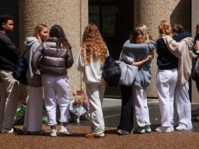 Pupils leave flowers at St Andrew's Cathedral School after the murder of water polo coach, Lilie James, at the school on Wednesday. Picture: Justin Lloyd