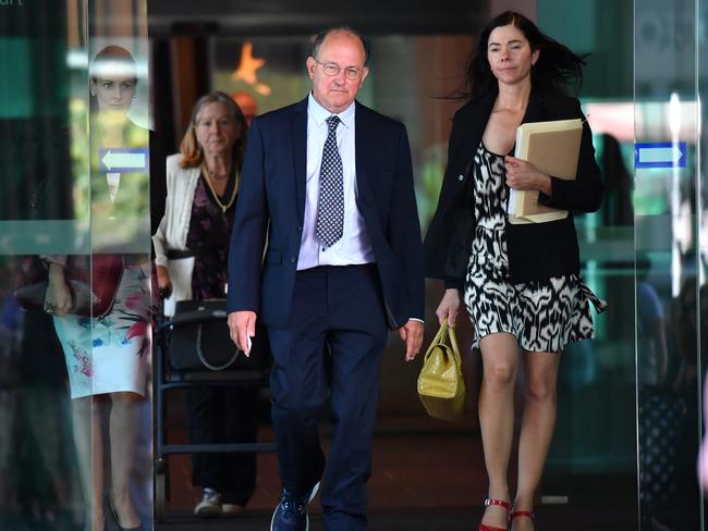 Dr William Russell Massingham Pridgeon (centre) is seen leaves Brisbane Magistrates Court in 2019.