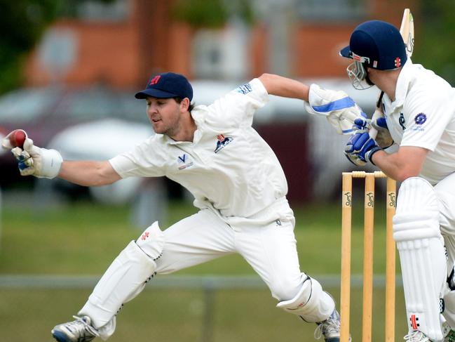 Premier Cricket: Dandenong v Prahran at Shepley Oval. Dandenong keeper Rob Hearn and Prahran batsman James Miller in action.