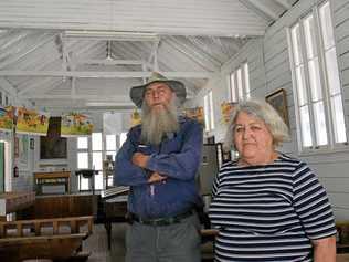 WRONGED: Chinchilla Historical Museum caretaker Oscar Lawrence and volunteer Joan Hubbard, pictured in the broken-in original Chinchilla State School, are disappointed in the recent museum theft. Picture: Amani Vassiliou