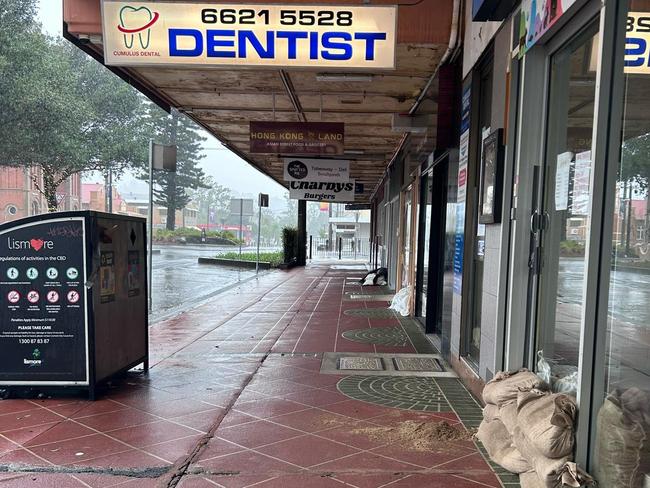 The streets of Lismore are deserted and shop fronts prepared for the incoming weather event. Picture: Remy Varga