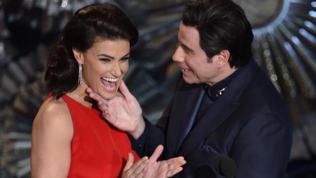 HOLLYWOOD, CA - FEBRUARY 22:  Actress Idina Menzel and actor John Travolta speak onstage during the 87th Annual Academy Awards at Dolby Theatre on February 22, 2015 in Hollywood, California.  (Photo by Kevin Winter/Getty Images)