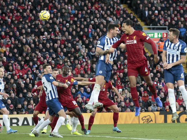 Liverpool's Virgil van Dijk, second right, scores his second goal during the English Premier League soccer match between Liverpool and Brighton at Anfield Stadium, Liverpool, England, Saturday, Nov. 30, 2019. (AP Photo/Jon Super)