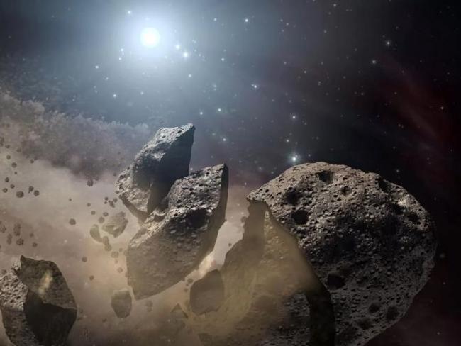 A NASA artist's concept of a fragmented asteroid still hurtling forward at tens of thousands of kilometres an hour. Picture: NASA