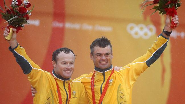 Glenn Ashby (right) and Darren Bundock (left) celebrate after winning silver at the 2008 Olympics. Picture: Pascal Lauener