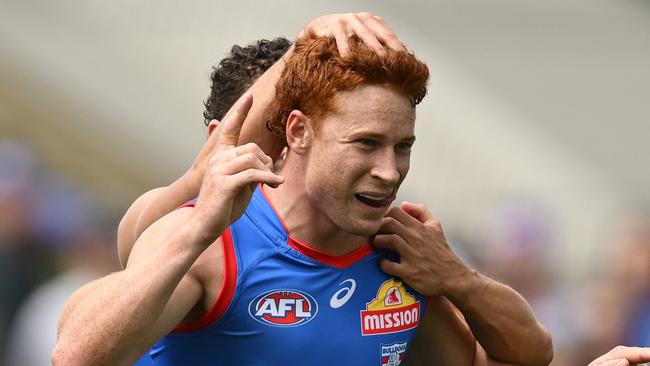 MELBOURNE, AUSTRALIA - FEBRUARY 15: Ed Richards of the Bulldogs celebrates kicking a goal during the 2025 AFL Pre-Season match between Western Bulldogs and Essendon Bombers at Whitten Oval on February 15, 2025 in Melbourne, Australia. (Photo by Quinn Rooney/Getty Images)