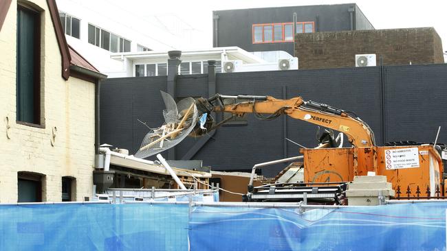 An excavator working on the stables area at the rear of the Royal Oak Hotel. Demolition work continues on the Royal Oak Hotel in North Parramatta, to make way for the Parramatta Light Rail. Picture: John Appleyard