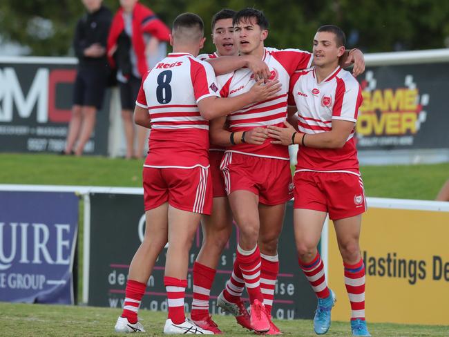 PBC’s Ryan Rivett is congratulated by teammates after scoring the first try. Picture: Glenn Hampson