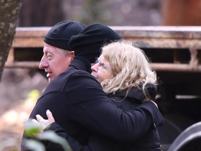 NSW Police Detective Chief Inspector Gary Jubelin hugs Faye Leveson (left) after almost 10 years of search for their son’s body. Picture: Dean Lewins