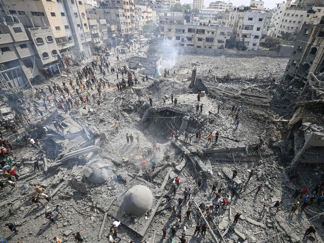 Palestinians inspect the damage following an Israeli air strike on the Sousi mosque in Gaza City. Picture: Mahmud Hams/AFP