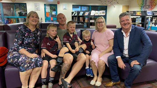 Kieran, Jessica, Archie (9), Harry (5), and Rocco (4) Whaley with Chief Minister Eva Lawler and Education Minister Mark Monaghan.