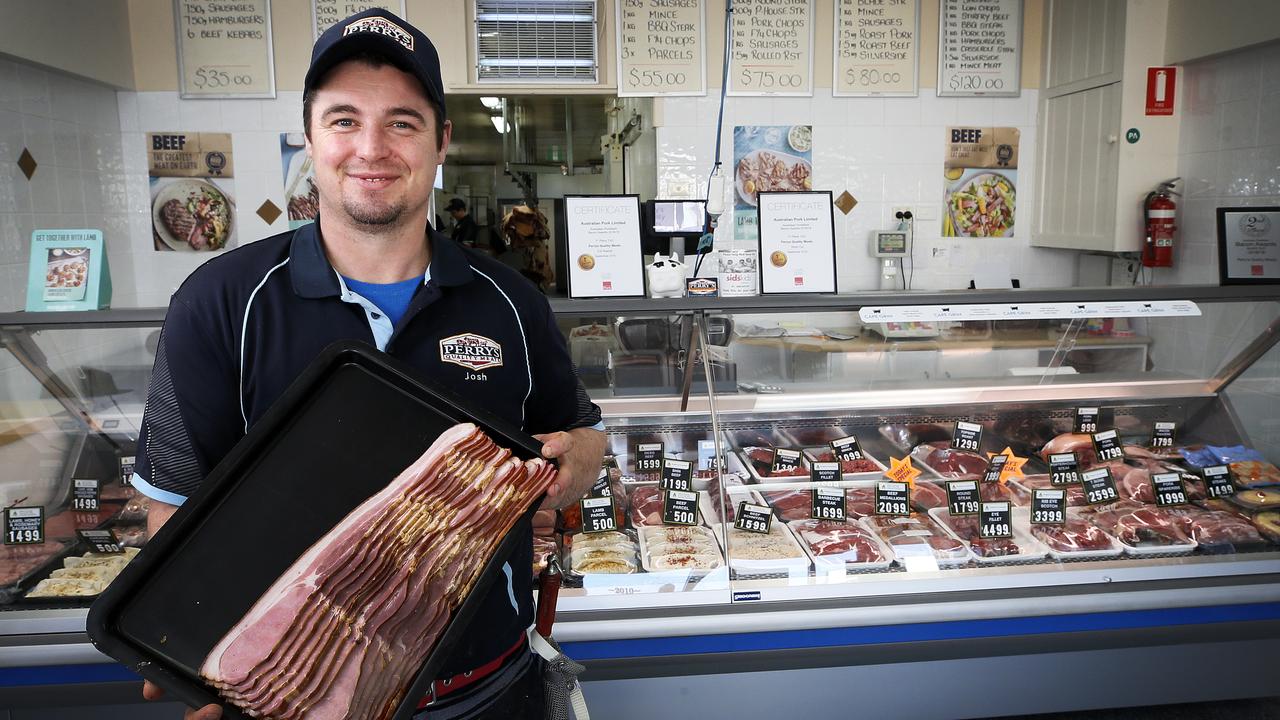 Josh Perry with his award-winning bacon at Smithton. PICTURE CHRIS KIDD