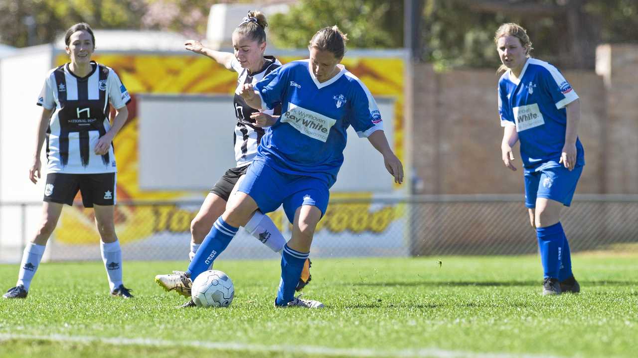 Rockville's Dawn Holden takes possession of the ball during last year's Toowoomba Football League Premier Women's grand final. Holden captained Rockville in their loss to Highfields at the weekend. Picture: Kevin Farmer