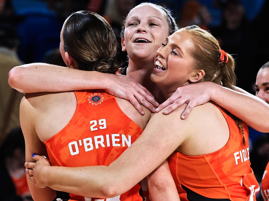 Jo Harten hugs Giants’ teammates after the Giants win over Queensland Firebirds at Ken Rosewall Arena. Picture: Jenny Evans/Getty Images