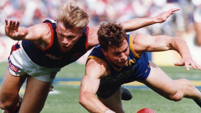 Norwood footballer Anthony Eames and Eagles’ Paul Chapman in the 1993 SANFL grand final. Picture: Mark Brake