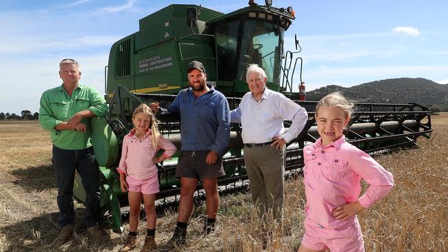 Matthew Richmond  harvesting wheat, 4 generations,  with his uncle Craig Richmond, father Tom Richmond,  87, his daughters Peyton & Ava, both 7 years old,   Little River,   Picture Yuri Kouzmin