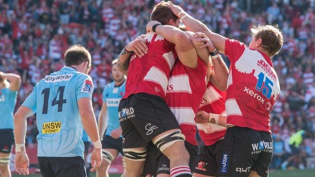 Lions players celebrate a try to Kwagga Smith. Picture: AFP