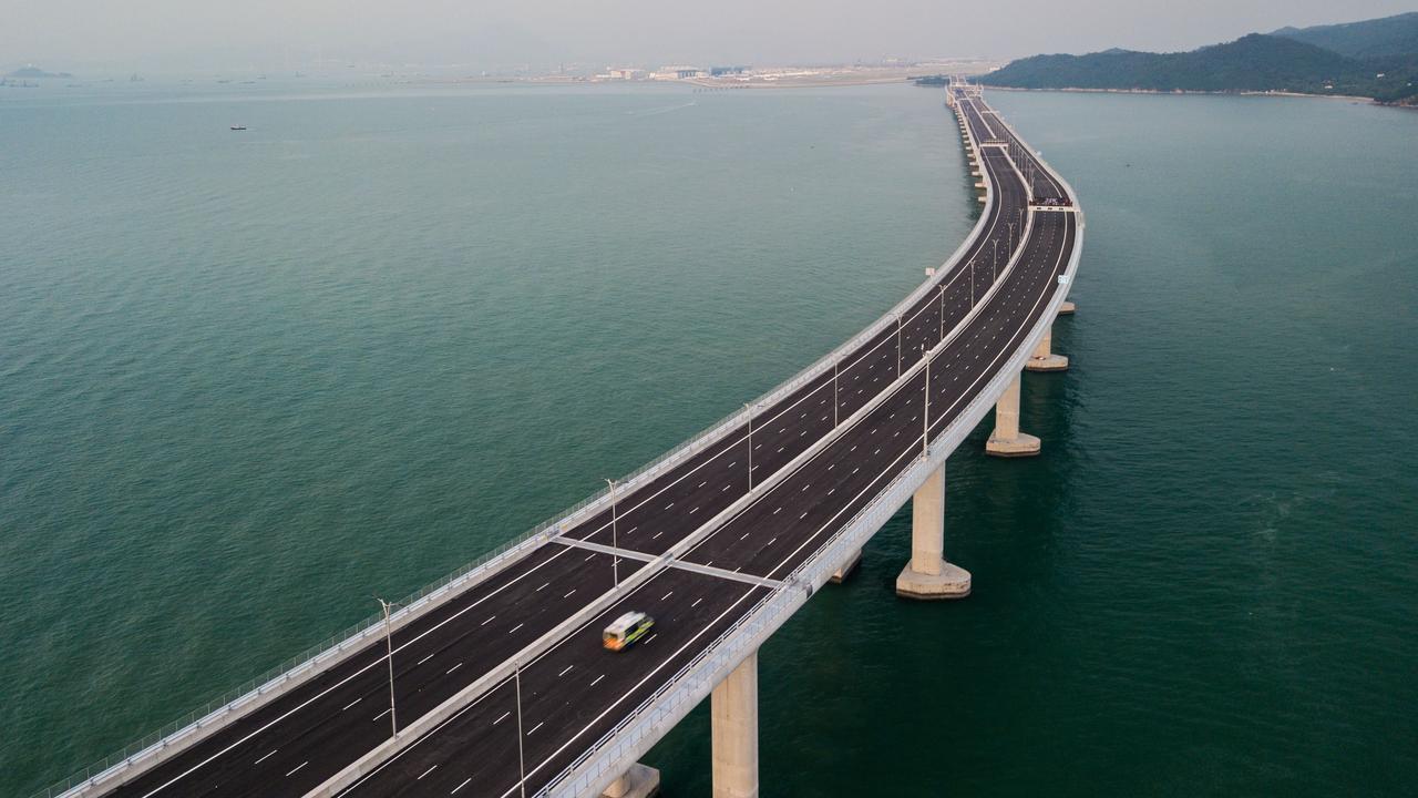 An aerial view shows a van being driven on a section of the Hong Kong-Zhuhai-Macau Bridge (HKZM). Picture: AFP