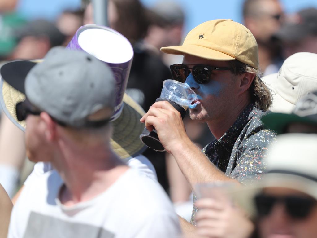 Fans enjoying the hot weather at the Big Bash match between the Hurricanes and Melbourne Stars at Blundstone Arena on Christmas Eve. Picture: LUKE BOWDEN