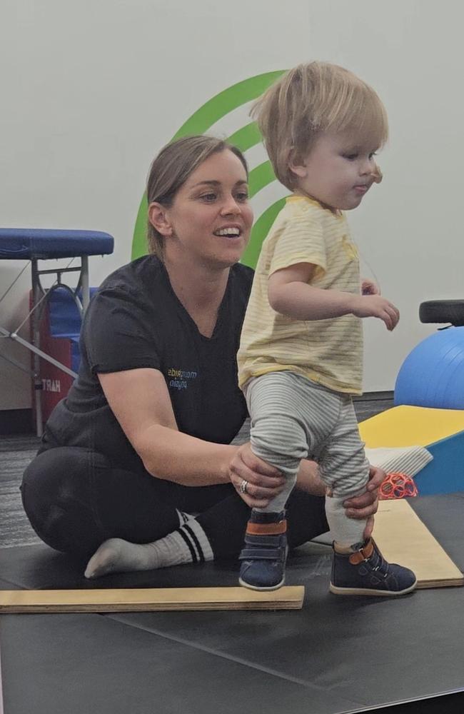 Aemilius and Nicole Moffatt at Moving Kids Physio in Adelaide doing dynamic movement intervention therapy. Picture: Supplied/ Alexis Taylor