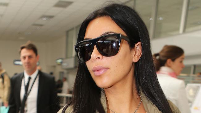 Kim Kardashian showed off the first hint of her baby bump in Nice, France.