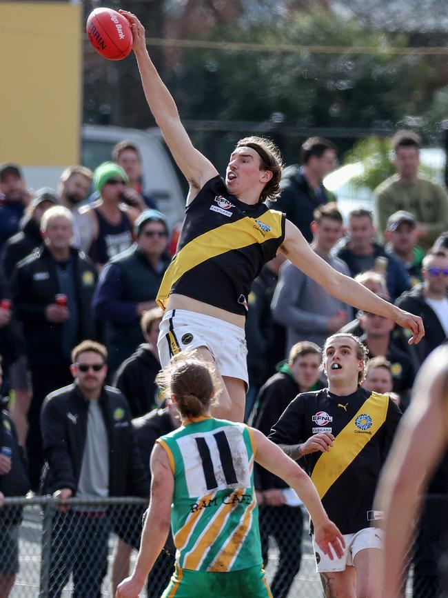 EFL: Tom Lovell jump highest for Mitcham. Picture: George Salpigtidis