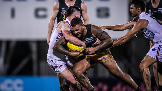 St Mary's Jake Toa takes the game on against Southern Districts in Round 12 of the 2023-24 NTFL season. Picture: Patch Clapp / AFLNT Media