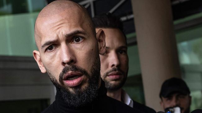 Andrew Tate (L) and Tristan Tate (R) arrive in the United States after a travel ban on them was lifted, at the Fort Lauderdale-Hollywood International Airport on February 27, 2025. (Photo by Alon Skuy / GETTY IMAGES NORTH AMERICA / Getty Images via AFP)