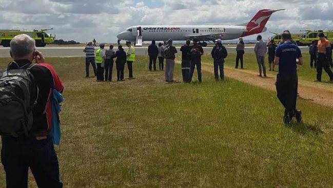 More than 100 passengers had to evacuate a Qantas plane after it landed from Newman with reports of smoke in the cockpit. Picture: Channel Nine News