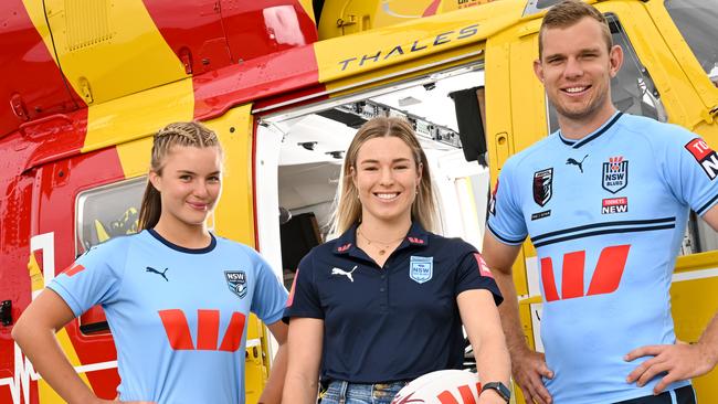 NSW Blues stars Emma Tonegato (middle) and Tom Trbojevic (right) and emerging star Lacey Cross (left) show off the Blues’ new kit for 2023. Picture: Supplied.