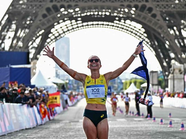 Third placed Australia's Jemima Montag celebrates after the mixed marathon race walk relay of the athletics event at the Paris 2024 Olympic Games at Trocadero in Paris on August 7, 2024. (Photo by Gabriel BOUYS / AFP)