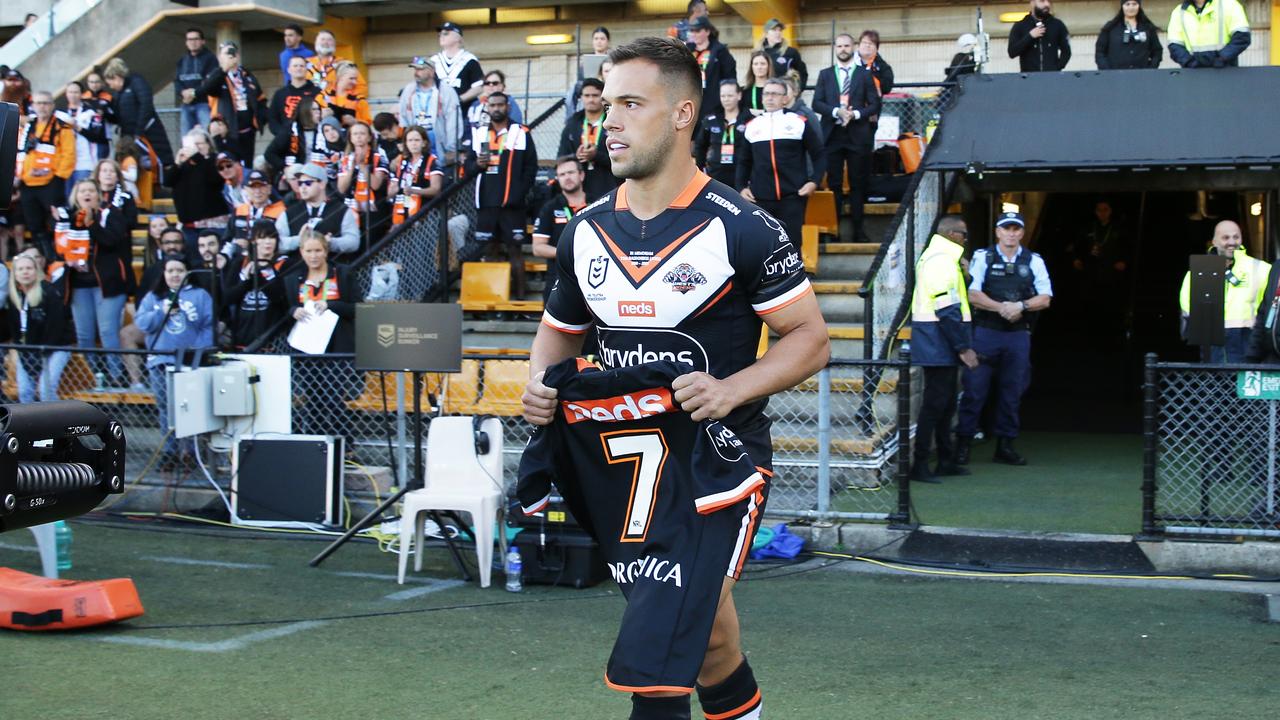 Luke Brooks brings out Tommy Raudonikis’ tribute jersey.