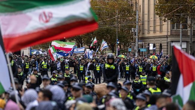 Pro-Palestine activists near the Victorian Parliament in May as police stand guard to avoid clashes with the other groups. Picture: Diego Fedele/Getty Images