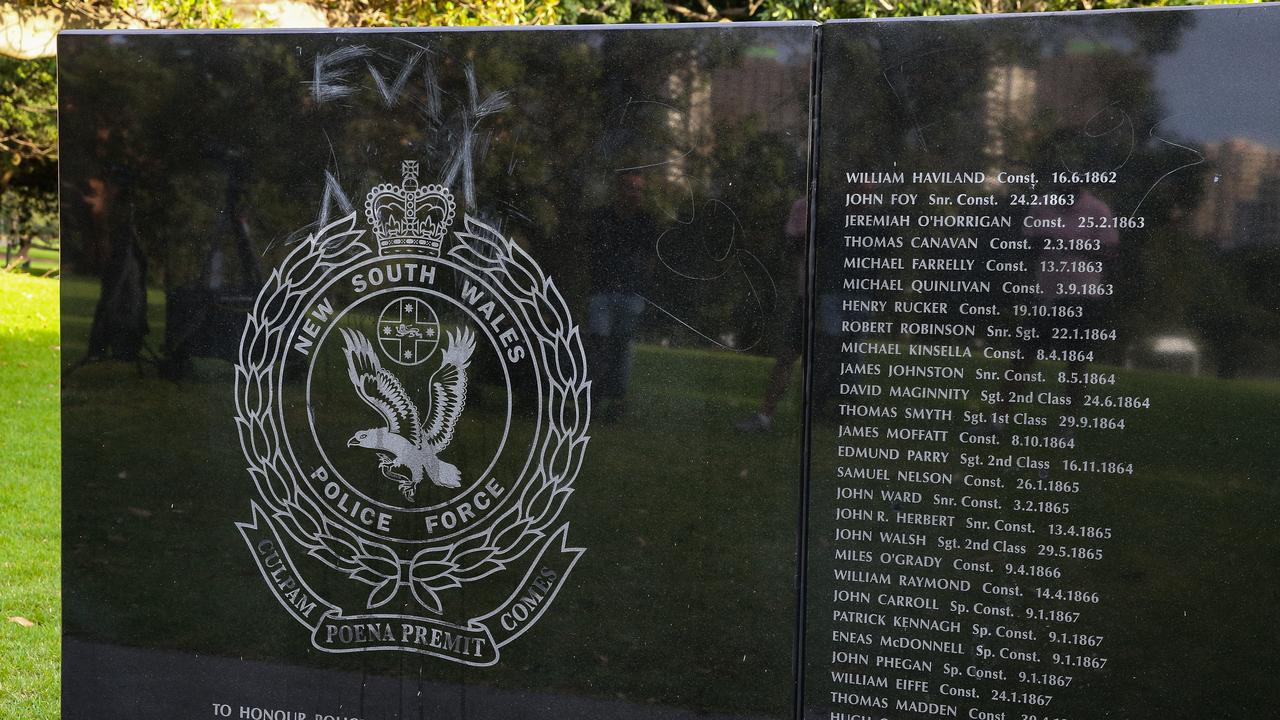 An investigation has been launched after the words “dogs” and “evil’ were scribbled on a police monument was damaged in Sydney’s Domain. Picture: NewsWire/ Gaye Gerard