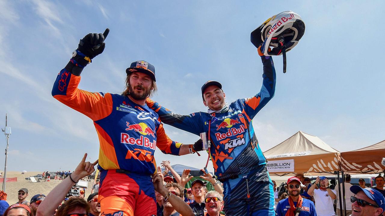 Toby Price (left) celebrates with Ktm's Austrian biker Matthias Walkner after winning the Dakar Rally 2019. Picture: AFP