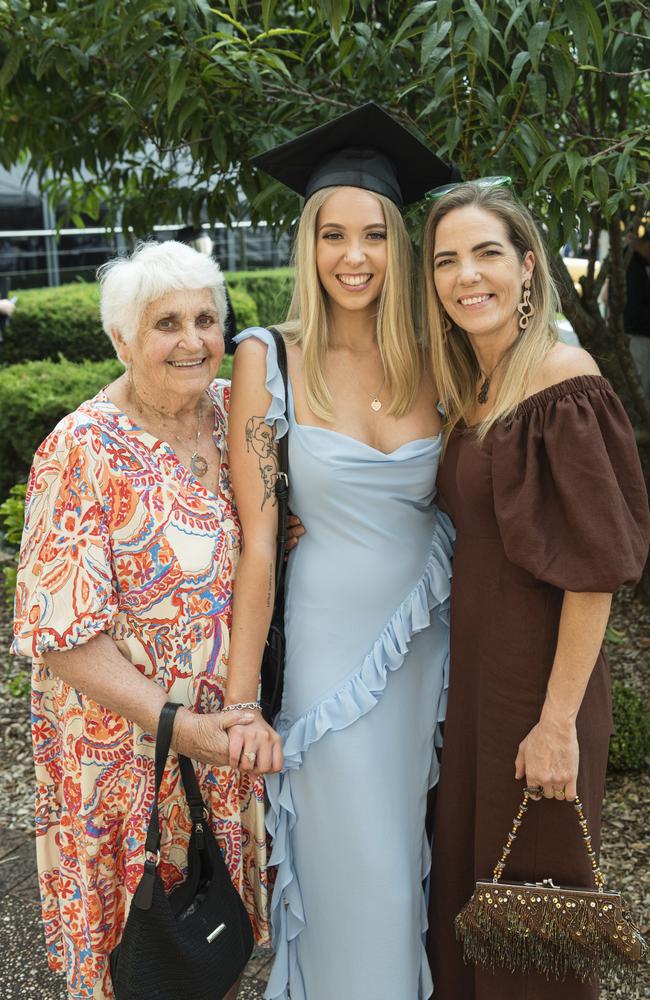 Bachelor of Nursing graduate Jasmyn Bloodworth is congratulated by grandmother June Bloodworth and mum Andrea Bloodworth at a UniSQ graduation ceremony at Empire Theatres, Tuesday, February 13, 2024. Picture: Kevin Farmer