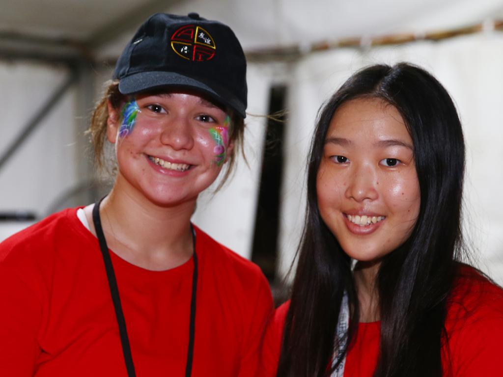 Emma Lyle and Jooa Hwang at the Cairns and District Chinese Association Inc Chinese New Year street festival on Grafton Street. PICTURE: BRENDAN RADKE